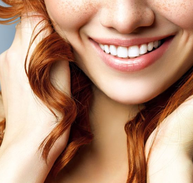 Close-up of woman’s beautiful, bright smile