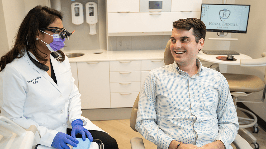 Doctor With Patient In Chair