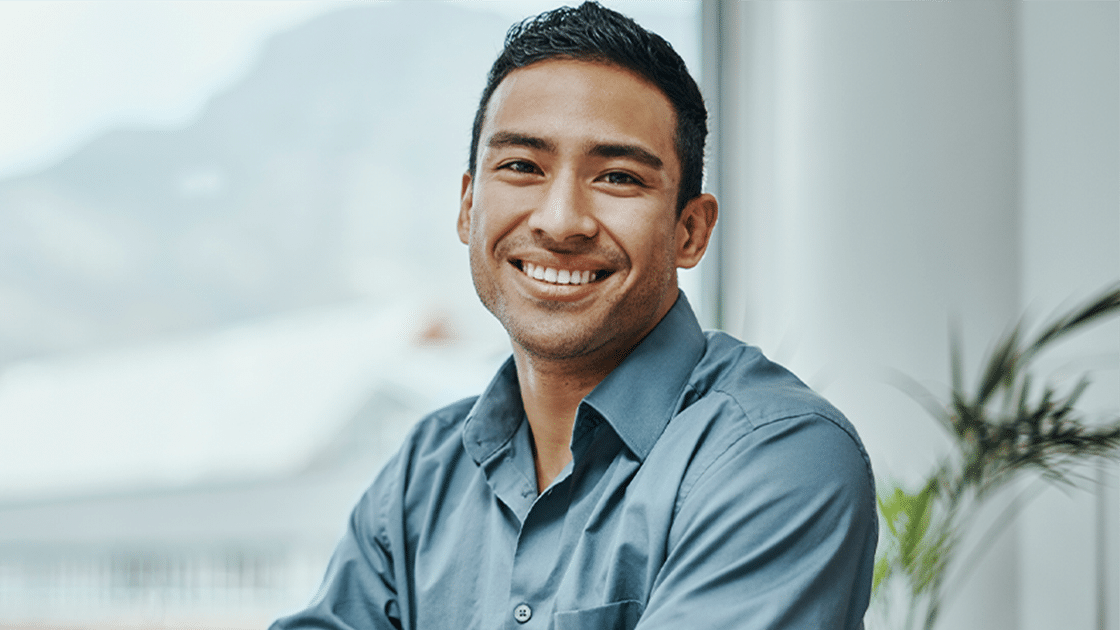 Smiling Man At Desk 